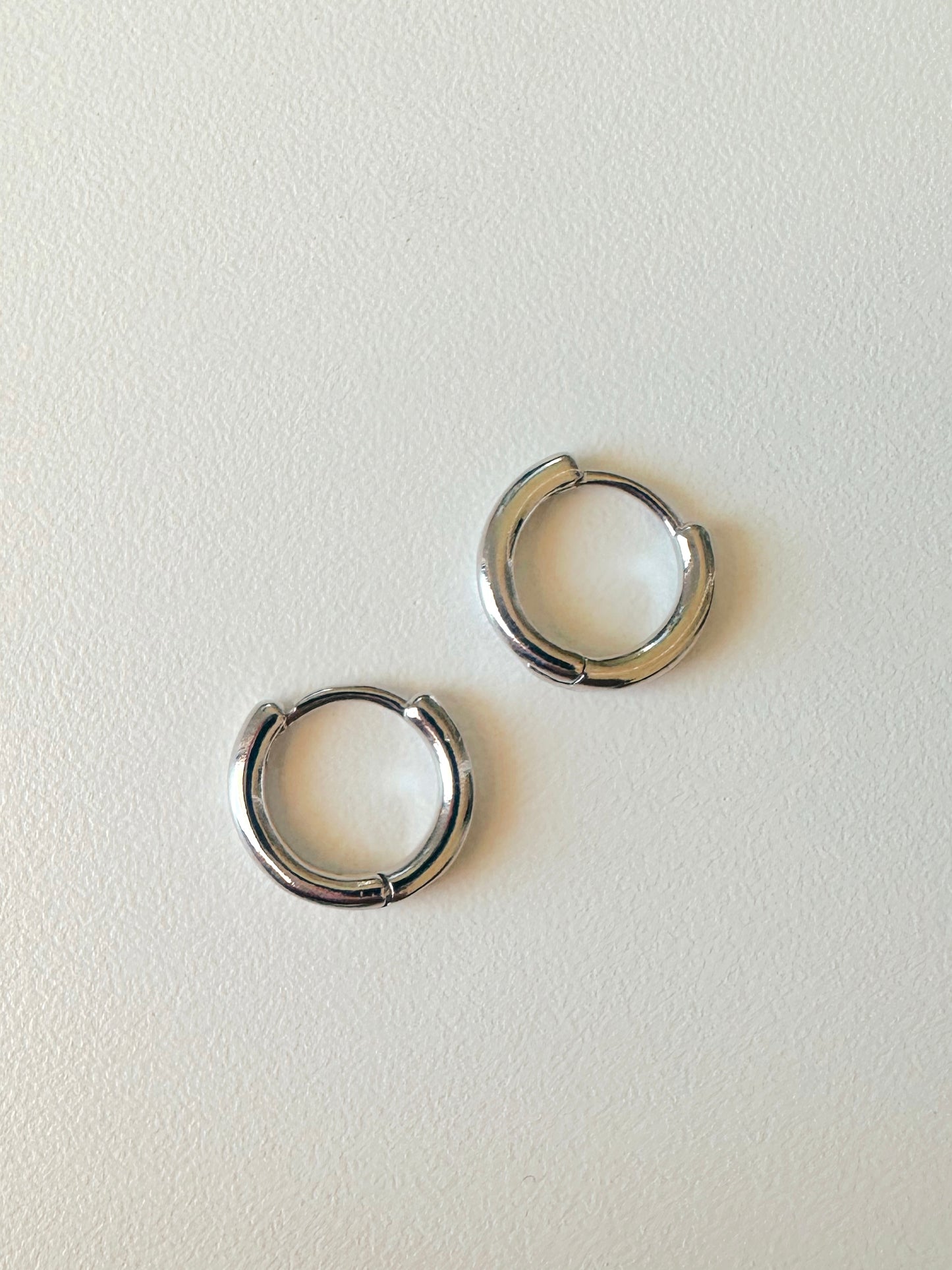 Small silver huggie